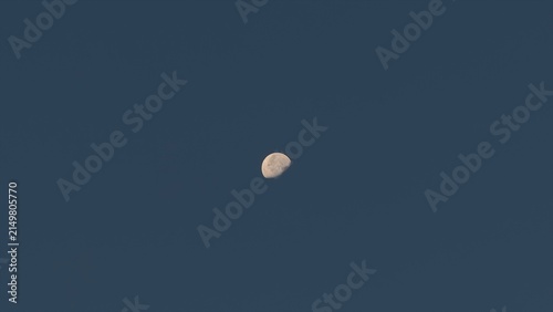 Canvastavla Waning gibbous moon in a clear blue twilight sky