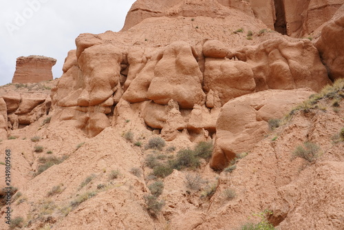 Cuadro en lienzo Red Danxia Landform Canyon with Stratified Red Rock Cliffs Under Blue Sky