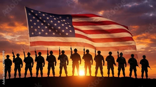 American soldiers silhouettes standing on hill at sunset with united states flag waving behind them dynamic motion.