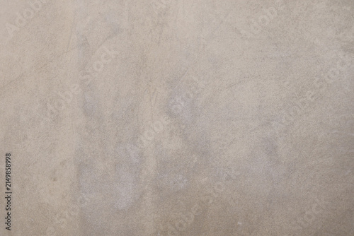 neutral grey beige concrete wall texture with subtle plaster marks, industrial rustic cement background concept for design and copy space.
