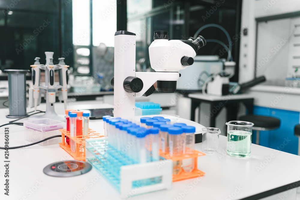 Fototapeta premium Medical research action by scientists in a laboratory environment featuring advanced equipment and techniques