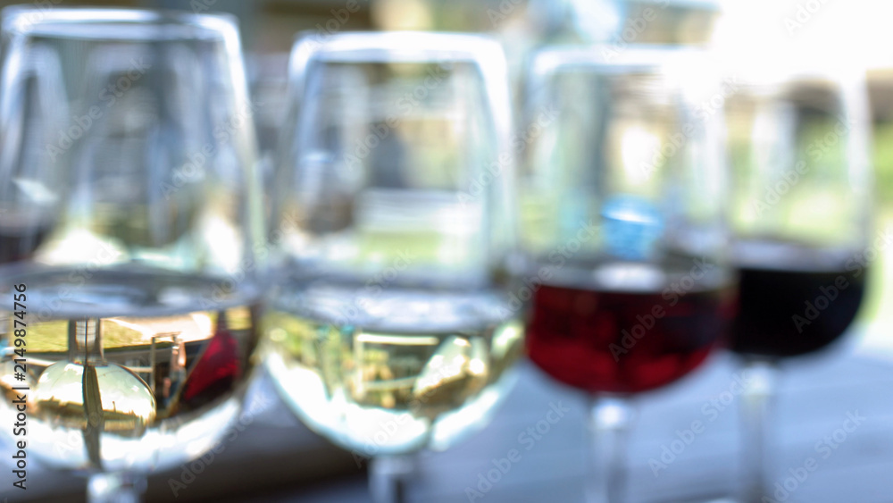 Obraz premium Close Up of Red and White Wine Flight on Outdoor Table
