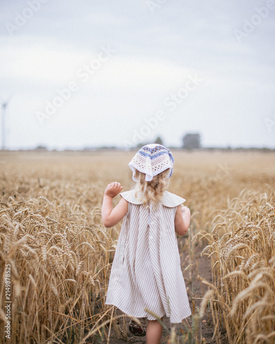 little girl in a wheat field