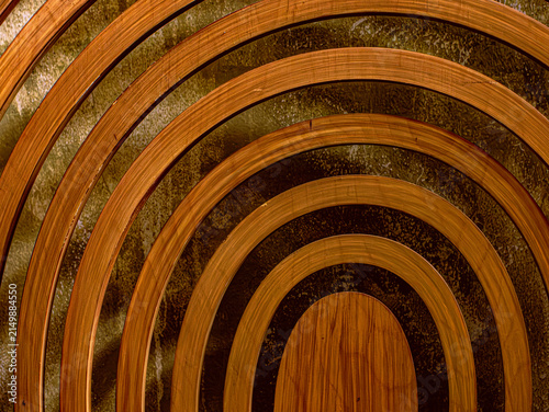 Abstract Concentric Wooden Arch Rings Pattern with Warm Amber Tones Background