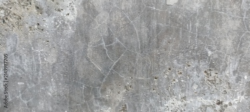 Gray Concrete Texture Background with rough cement surface, fine cracks, stains and natural imperfections, ideal for architectural designs, industrial backgrounds and graphic projects
