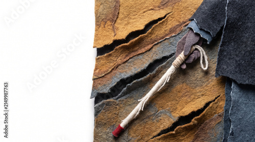 Blind person holding a white cane on textured backdrop  