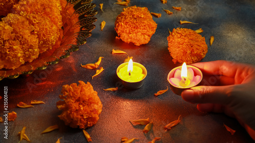 Happy Diwali, Indian festival of lights decorated with marigolds and candles.