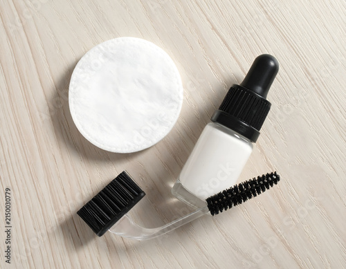 Cosmetic Dropper Bottle with Mascara Wand and Cotton Pad.