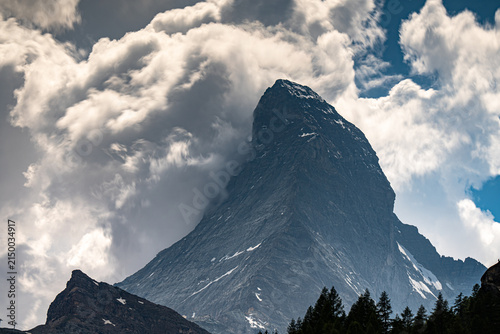 Photography Dramatic Matterhorn mountain peak engulfed by storm clouds during summer in Zerm