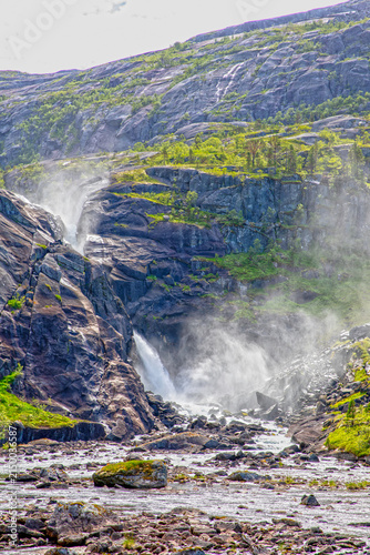 Nykkjesøyfossen Waterfall Flowing Through Rocky Husedalen Valley in Hardanger, Norway