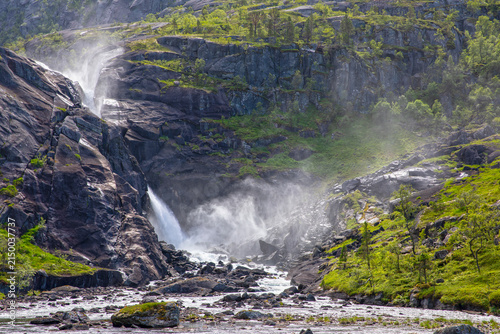 Nykkjesøyfossen Waterfall Flowing Through Rocky Husedalen Valley in Hardanger, Norway
