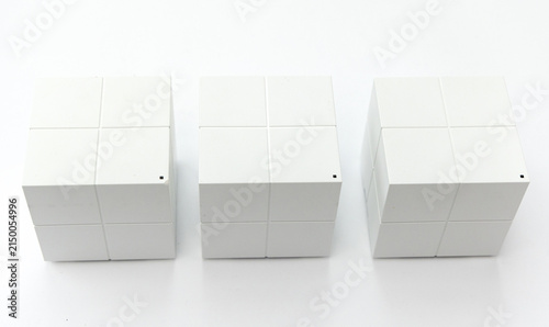 Quadro su tela Three identical white cubic network routers on white background