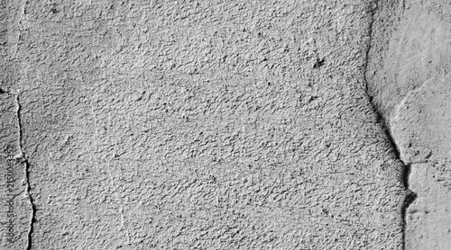 Weathered and cracked gray concrete wall texture