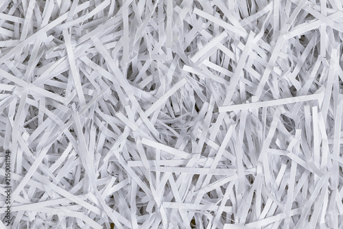 Bild auf Leinwand Background texture of white shredded paper strips top view close up