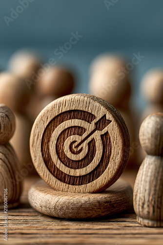 Business target and goal achievement concept with wooden figures