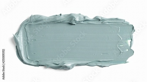 Light green cosmetic clay face mask texture swatch with cosmetic skincare treatment moisturizer application