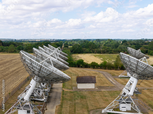 Large Radio Telescope Array Antennas Set in the English Countryside During Daylight