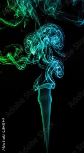 Wispy clouds of vibrant emerald and sapphire smoke drift through a dark void, offering a hauntingly beautiful mystery and horror texture, green, wispy, spectral