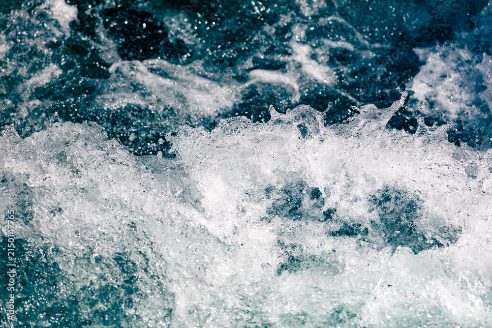 Fototapeta premium Churning ocean waves crash with white foam