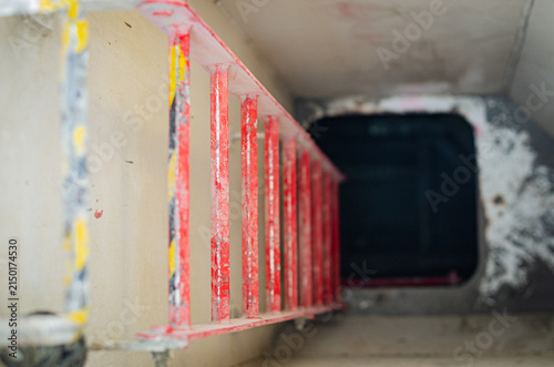 Quadro su tela Fixed vertical access ladder installed inside a compartment on board an offshore support vessel, providing access to an upper or lower deck level through a confined passage
