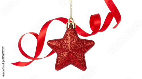 A dazzling red glitter star christmas ornament hangs gracefully with a flowing red ribbon evoking holiday cheer