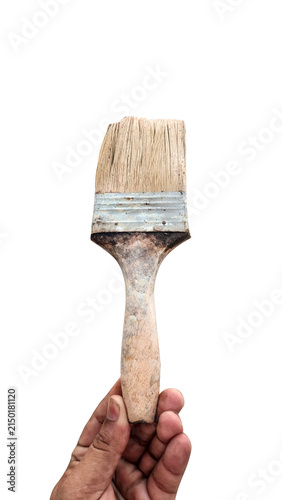 Aged paint brush held by hand for diy on transparent background