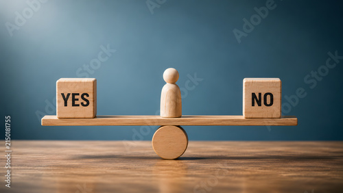 Plain wooden figure acting as a pivot balancing yes and no blocks. Concept of impartial legal arbitration and business conflict.