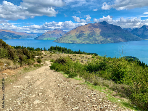 Gravel Path Overlooking a Turquoise Lake in New Zealand