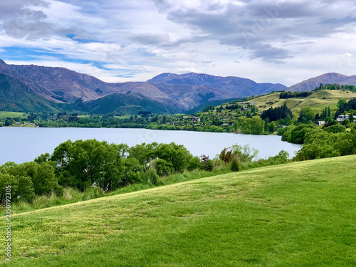 Rolling Green Meadow Above a Mountain Lake in New Zealand