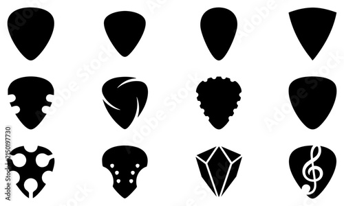 фотографія Set of black guitar picks in various shapes and designs for playing musical inst