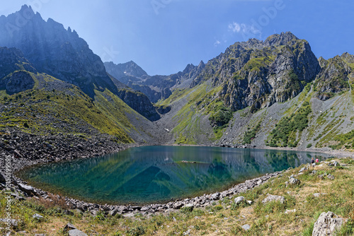 On the very steep-sided lake of Crop shores, one of the many found in the Belledonne massif near Grenoble