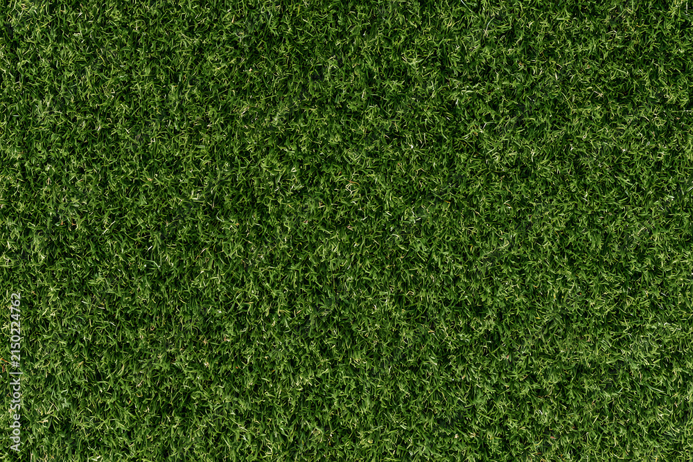 Fototapeta premium A top-down aerial photo texture of lush green sports field grass, suitable for a golf course, soccer field, football pitch, or rugby turf.