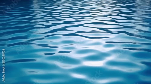 Aerial view of flowing ocean waves with light reflections