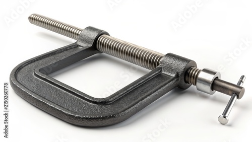 A close-up shot of a c-clamp, a handy tool for gripping and holding objects steady. Its metallic jaws and screw mechanism are clearly visible