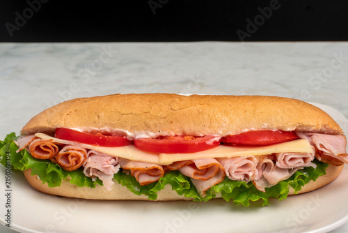 Фотография turkey  sub  served  top with swiss cheese