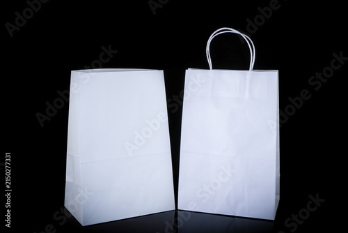 Set of paper bags for shopping on black background. Mockup for design