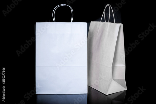 Set of paper bags for shopping on black background. Mockup for design