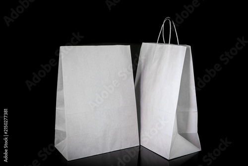 Set of paper bags for shopping on black background. Mockup for design