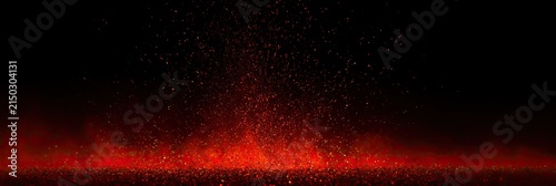 Glowing red embers and sparks ascend against a deep black backdrop