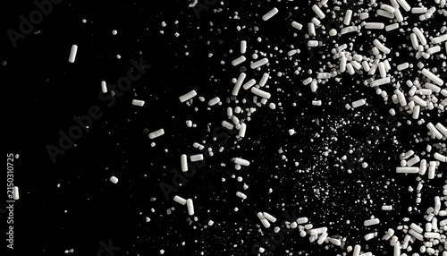 Abstract explosion of white sprinkles on a black background, perfect for food and dessert concepts