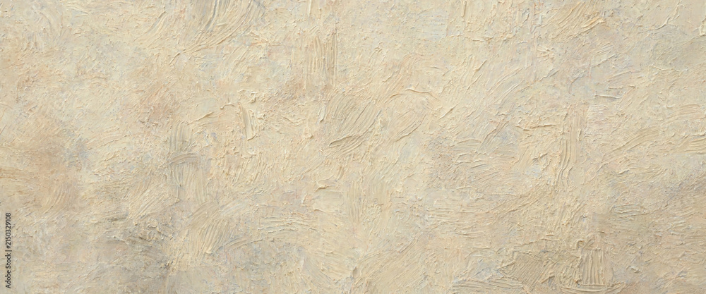 Fototapeta premium A detailed closeup view of a textured beige wall with visible brushstrokes creating a rough and artistic surface providing a sense of depth and warmth