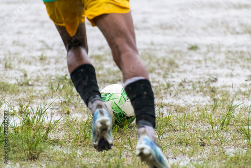Soocer player running to kick soccer ball