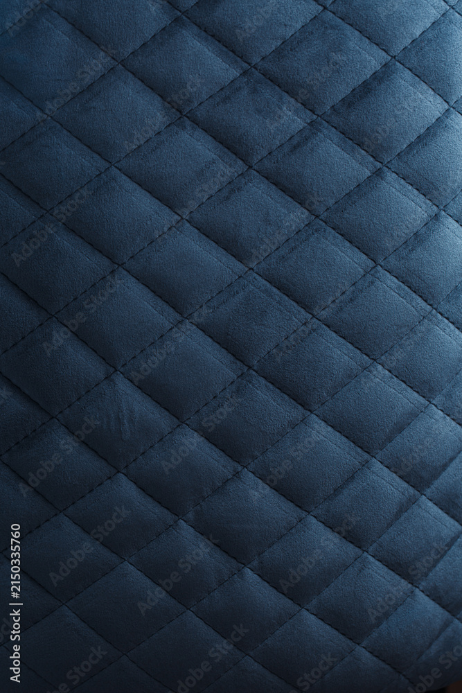 Obraz premium Dark Blue Quilted Velvet Upholstery Texture with Diamond Pattern and Soft Directional Light