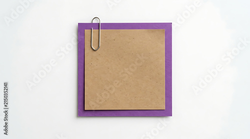 Clipboard with brown paper and purple frame holding a yellow sticky note