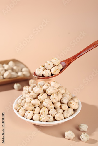 Crispy Fried Salted Chickpeas in Wooden Spoon and Bowl - Healthy Xinjiang Style Snack Food