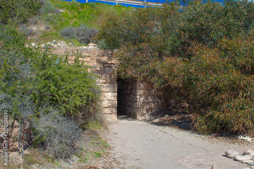 Obraz na plátně Stone entrance to the 'Petra tou Romiou' or 'Aphrodite's Rock' beach on the isla
