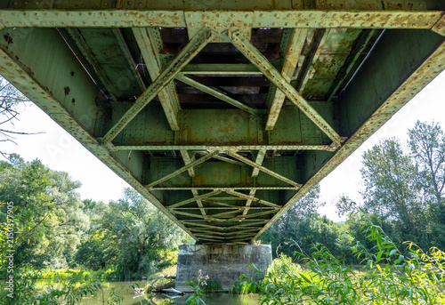 Bild auf Leinwand View of the railway bridge over the river from below