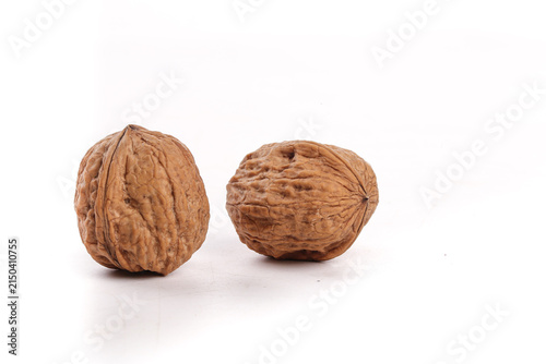 Konstfotografi Fresh Walnuts with Natural Brown Shells Isolated on White Background