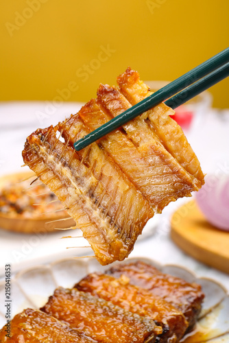 Obraz na plátně Braised Swordfish Section with Chopsticks - Asian Seafood Cuisine Close-up