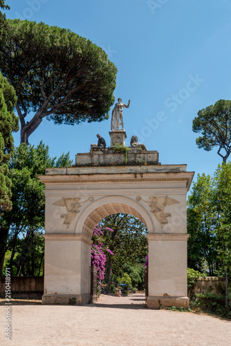 Arco Romano in the Villa Borghese Park in Rome, Italy a summer day with blue sky.